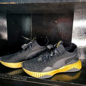 Puma Black and Gold shoes